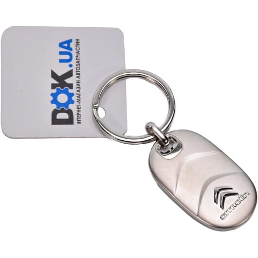 Брелок Citroen / Peugeot з логотипом сірий AMC0801319